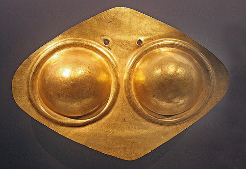 diamond-shaped breastplate with female breasts