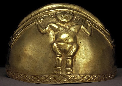 hemispheric helmet of beaten gold with female figure in relief holding ritual staffs