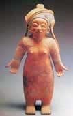 woman with outstretched hands, in reddish clay