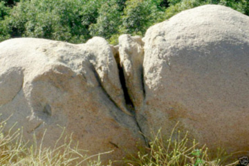 natural vulva rock formation enhanced by human hands