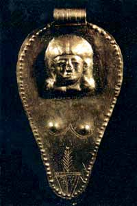 another golden triangular-ovoid amulet with woman's face and vulva